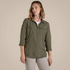 Koszula przeciw komarom damska Craghoppers NosiLife Adventure LS Shirt III. Zielone koszule Craghoppers, bez wzorów, z materiału, eleganckie, bez kołnierzyka, bez ramiączek. Za 369.99 zł.