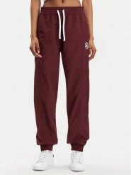 Converse Spodnie dresowe Star Printer 10026055-A02 Bordowy Tapered Fit. Czerwone spodnie dresowe Converse, bez wzorów, z dresówki. Za 249.99 zł.