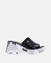 SKÓRZANE KLAPKI NA OZDOBNYM KOTURNIE 00832090 29 P BL. Klapki Venezia, bez wzorów, ze skóry, bez obcasa, na koturnie, bez zapięcia. Za 359.00 zł.