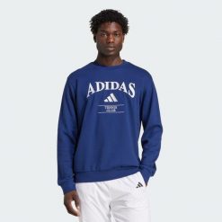 Bluza adidas Heritage Graphic Crew. Niebieskie bluzy bez kaptura adidas, m, bez wzorów, z bawełny, bez kaptura, tenisowe. Za 350.80 zł.