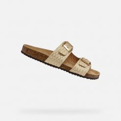 Sandały GEOX D BRIONIA Beżowy. Żółte sandały Geox, bez wzorów, ze skóry, bez obcasa, bez zapięcia. Za 315.99 zł.
