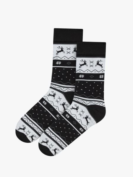 Biało-czarne skarpetki świąteczne unisex z reniferami. Czarne skarpetki Ryłko, bez wzorów, z bawełny. Za 24.99 zł.