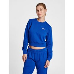 Damska krótka bluza Hummel LGC Shai. Niebieskie bluzy Hummel, s, bez wzorów, z bawełny, eleganckie, bez ramiączek, bez kaptura. Za 236.50 zł.