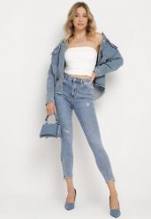 Jasnoniebieskie Bawełniane Jeansy Skinny z Przetarciami Erliaxa. Niebieskie jeansy Born2be, bez wzorów, z bawełny, klasyczne. W wyprzedaży za 84.99 zł.