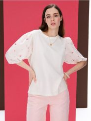 Bawełniania bluzka z bufiastym rękawem - kremowy. Białe bluzki Sinsay, l, bez wzorów, z bawełny, bez kołnierzyka, bez ramiączek. Za 29.99 zł.