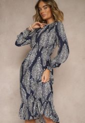 Niebieska Rozkloszowana Sukienka w Etniczny Print z Gumką w Talii i Falbanką Napirea. Niebieskie sukienki Renee, na co dzień, m, bez wzorów, eleganckie, bez kołnierzyka, bez ramiączek, midi, rozkloszowane. W wyprzedaży za 83.99 zł.