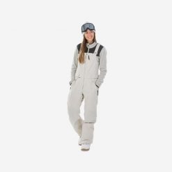 Second Life - Spodnie snowboardowe ogrodniczki damskie... - Stan Dobry. Brązowe spodnie narciarskie DREAMSCAPE, bez wzorów, z materiału, narciarskie. Za 399.00 zł.