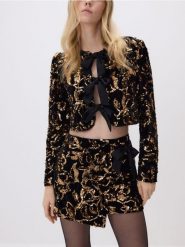 Cekinowa marynarka z kokardami - czarny. Czarne marynarki i żakiety Reserved, l, bez wzorów, z dzianiny, bez ramiączek. Za 179.99 zł.