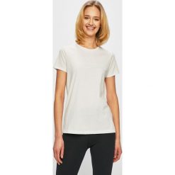 Under Armour - Top. Białe t-shirty Under Armour, bez wzorów, z bawełny, bez kołnierzyka, bez ramiączek. W wyprzedaży za 59.90 zł.