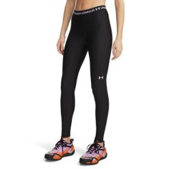 Legginsy fitness damskie Under Armour HeatGear. Czarne legginsy Under Armour, bez wzorów, z materiału, sportowe. Za 199.99 zł.