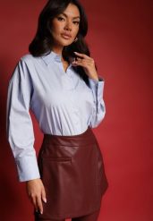 Jasnoniebieska Casualowa Koszula z Bawełny Naliraella. Niebieskie koszule Renee, l, bez wzorów, z bawełny, biznesowe, bez kołnierzyka, bez ramiączek. W wyprzedaży za 67.99 zł.