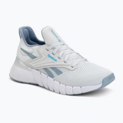 Buty treningowe damskie Reebok Nano Gym. Szare buty treningowe Reebok, bez wzorów, z materiału, bez zapięcia, na fitness i siłownię. Za 399.99 zł.