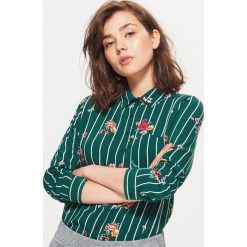 Klasyczna koszula z nadrukiem - Khaki. Koszule marki QUECHUA. W wyprzedaży za 39.99 zł.
