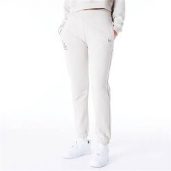 Spodnie sportowe damskie New Era 60435304. Białe spodnie dresowe New Era, bez wzorów, z dresówki. Za 528.00 zł.
