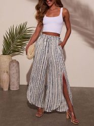 Milan Kiss Spodnie w kolorze niebiesko-białym rozmiar: L. Białe spodnie materiałowe Milan Kiss, bez wzorów, z materiału, z podwyższonym stanem. Za 122.09 zł.