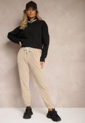 Ciemnobeżowe Dresowe Spodnie z Bawełną High Waist Wykończone w Pasie Gumką Ekadela. Brązowe jeansy Renee, l, bez wzorów, z bawełny, z podwyższonym stanem. W wyprzedaży za 47.99 zł.
