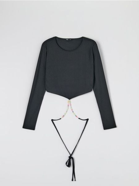 Bluzka z wiązaniem - czarny. Czarne bluzki Sinsay, l, bez wzorów, bez kołnierzyka, bez ramiączek. W wyprzedaży za 29.99 zł.