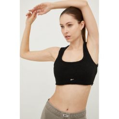 Reebok Classic top damski kolor czarny. Czarne topy Reebok Classic, m, bez wzorów, z dzianiny, bez kołnierzyka, bez ramiączek. W wyprzedaży za 88.99 zł.