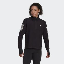 Bluza do biegania Own the Run Running 1/2 Zip. Czarne bluzy adidas, xs, bez wzorów, z materiału, sportowe, bez ramiączek, bez kaptura. W wyprzedaży za 204.25 zł.