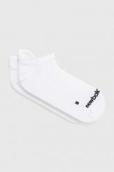 New Balance skarpetki kolor biały. Białe skarpetki New Balance, bez wzorów, ze skóry. W wyprzedaży za 41.99 zł.