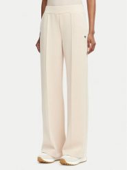 Guess Spodnie dresowe V6YB18 K4315 Beżowy Regular Fit. Brązowe spodnie sportowe Guess, z aplikacjami, z dresówki. Za 394.99 zł.