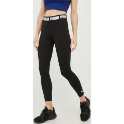 Puma legginsy treningowe Strong damskie kolor czarny gładkie. Czarne legginsy Puma, bez wzorów, ze skóry. Za 199.99 zł.