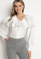 Biała Elegancka Koszula Ozdobiona Falbanami i Guzikami Leristta. Białe koszule Born2be, s, bez wzorów, z jeansu, eleganckie, bez kołnierzyka, bez ramiączek. W wyprzedaży za 72.24 zł.