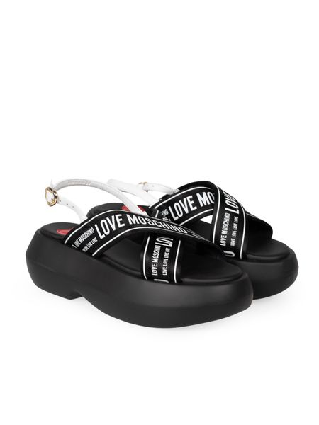 Love Moschino Sandały | JA16257I0IIX6 | Kobieta | Czarny, Biały. Białe sandały Love Moschino, bez wzorów, bez obcasa, bez zapięcia. W wyprzedaży za 499.00 zł.