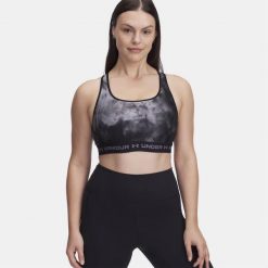 Damski Top Biustonosz Sportowy Under Armour Crossback Mid Print. Czarne biustonosze sportowe Under Armour, bez wzorów, na fitness i siłownię. Za 129.99 zł.