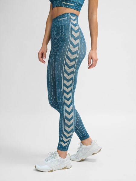 Damskie legginsy bezszwowe Hummel MT Drops. Niebieskie legginsy Hummel, bez wzorów, z dzianiny, klasyczne. Za 160.02 zł.