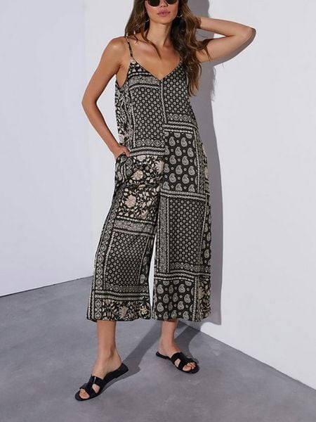 Milan Kiss Kombinezon w kolorze czarno-kremowym rozmiar: L. Czarne kombinezony Milan Kiss, l, bez wzorów, bez kołnierzyka, bez ramiączek. Za 162.87 zł.