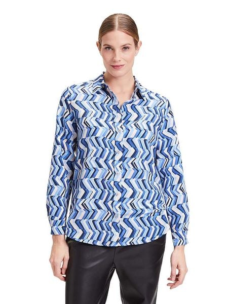 CARTOON Bluzka w kolorze niebieskim rozmiar: 38. Niebieskie bluzki Cartoon, bez wzorów, bez kołnierzyka, bez ramiączek. Za 52.42 zł.