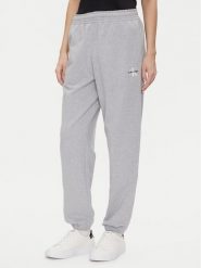 Calvin Klein Jeans Spodnie dresowe Monologo LV047B235G Szary Regular Fit. Szare spodnie dresowe Calvin Klein Jeans, bez wzorów, z bawełny. Za 389.99 zł.