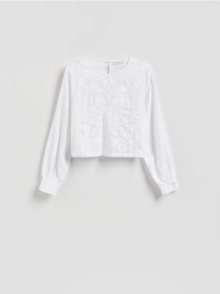 Bluzka z haftowanym wzorem - złamana biel. Bluzki Reserved, l, bez wzorów, z bawełny, bez kołnierzyka, bez ramiączek. W wyprzedaży za 69.99 zł.