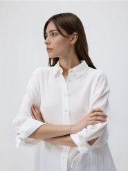 Muślinowa koszula - biały. Białe koszule Reserved, l, bez wzorów, z bawełny, bez kołnierzyka, bez ramiączek. Za 109.99 zł.