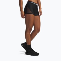 Spodenki treningowe damskie Under Armour HeatGear Mesh Shorty. Czarne szorty sportowe Under Armour, bez wzorów, z meshu, na fitness i siłownię. Za 94.99 zł.