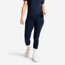 Legginsy sportowe damskie Domyos Essential. Niebieskie legginsy DOMYOS, bez wzorów, z bawełny, sportowe, długie. Za 19.99 zł.
