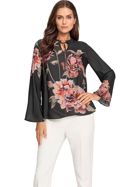 Heine Bluzka ze wzorem rozmiar: 42. Czarne bluzki Heine, bez wzorów, bez kołnierzyka, bez ramiączek. Za 112.45 zł.