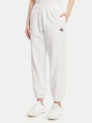 Calvin Klein Jeans Spodnie dresowe Monologo LV047B235G Biały Regular Fit. Białe spodnie dresowe Calvin Klein Jeans, bez wzorów, z bawełny. Za 259.99 zł.