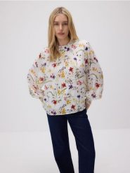Wzorzysta bluzka - miętowy. Zielone bluzki Reserved, l, bez wzorów, z tkaniny, bez kołnierzyka, bez ramiączek. W wyprzedaży za 49.99 zł.