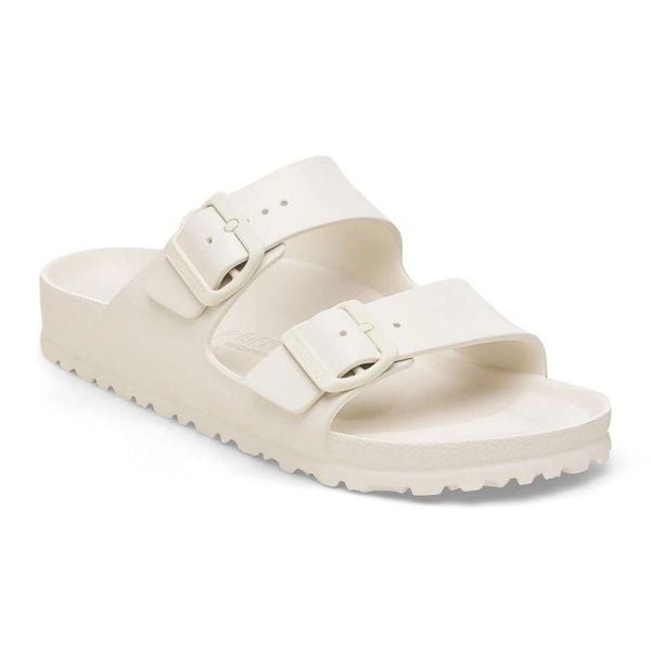 Sandały Damskie EVA Arizona. Białe sandały Birkenstock, bez wzorów, z materiału, z okrągłym noskiem, bez obcasa, na obcasie, bez zapięcia. Za 289.99 zł.