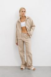 SPODNIE KAREN BEŻOWE M - Flawless. Brązowe spodnie sportowe Flawless, bez wzorów, z bawełny, wspinaczkowe. W wyprzedaży za 252.00 zł.