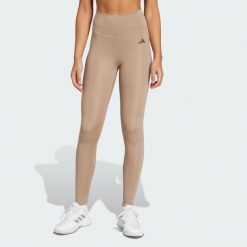 Długie legginsy Optimé Essentials Stash Pocket. Brązowe legginsy adidas, bez wzorów, z elastanu, długie. Za 210.00 zł.