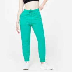Spodnie dresowe damskie Domyos Gym & Pilates. Zielone spodnie dresowe DOMYOS, bez wzorów, z bawełny. W wyprzedaży za 49.99 zł.