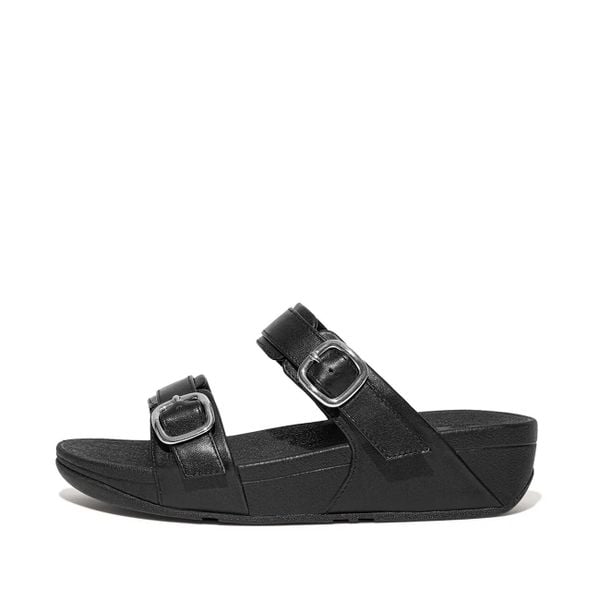 Kobiece klapki na koturnie FitFlop Lulu. Czarne klapki FIT FLOP, bez wzorów, z materiału, eleganckie, bez obcasa, na koturnie, bez zapięcia. Za 534.50 zł.