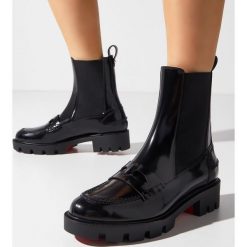 CHRISTIAN LOUBOUTIN - Czarne botki Montezu Lug Flat. Czarne botki CHRISTIAN LOUBOUTIN, bez wzorów, klasyczne, za kostkę, bez obcasa, bez zapięcia. Za 4,329.00 zł.