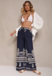 Granatowe Szerokie Spodnie z Wiskozy z Gumką w Talii Zdobione Etnicznym Wzorem Soleldi. Niebieskie jeansy Renee, l, z aplikacjami, z jeansu, eleganckie, z podwyższonym stanem. W wyprzedaży za 29.99 zł.