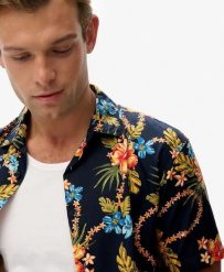 Superdry Koszula Hawaiian z nadrukiem, bawełna-modal. Niebieskie koszule Superdry, m, bez wzorów, z bawełny, klasyczne, bez kołnierzyka, bez ramiączek. Za 279.65 zł.
