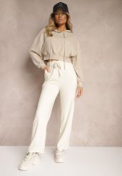 Jasnobeżowe Spodnie z Dodatkiem Wiskozy High Waist o Szerokim Kroju ze Sznurkami Isnia. Brązowe jeansy Renee, bez wzorów, z jeansu, eleganckie, z podwyższonym stanem. W wyprzedaży za 39.99 zł.