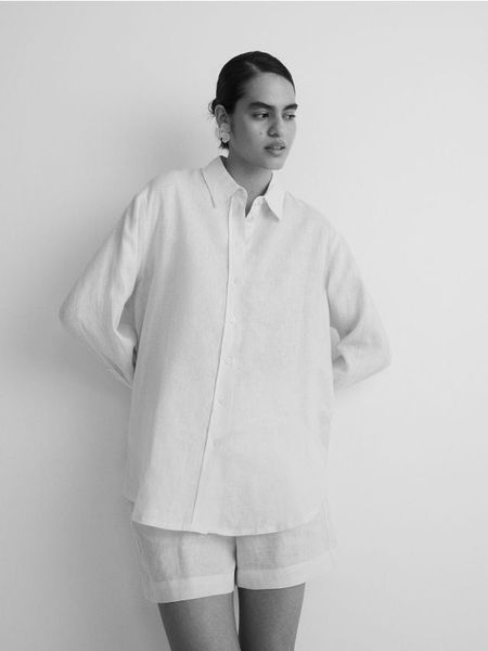 Koszula z lnu - złamana biel. Koszule Reserved, l, bez wzorów, bez kołnierzyka, bez ramiączek. W wyprzedaży za 159.99 zł.